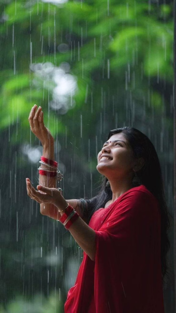 Monsoon Fashion: Latest Ethnic Wear Trends for Women In 2025 2 Monsoon Fashion: Latest Ethnic Wear Trends for Women In 2025 A lady wearing a red saree enjoying the rains