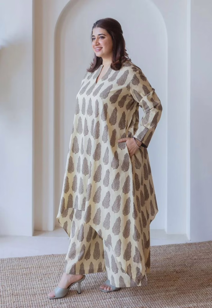 This is an image of lady wearing a high low hem Kurti 