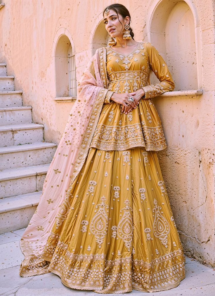 Top 5 Reasons Why Peplum Kurtis Deserve Space in Your Ethnic Wardrobe 7 Top 5 Reasons Why Peplum Kurtis Deserve Space in Your Ethnic Wardrobe This is a woman wearing a bright yellow peplum Kurti festive wear dress