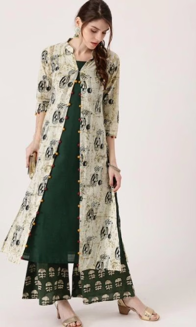 Woman wearing a layered kurta outfit with a printed long jacket-style kurta over a solid inner kurta and flared pants, paired with heels and minimal accessories—stylish kurta outfits women can wear for a modern ethnic look.