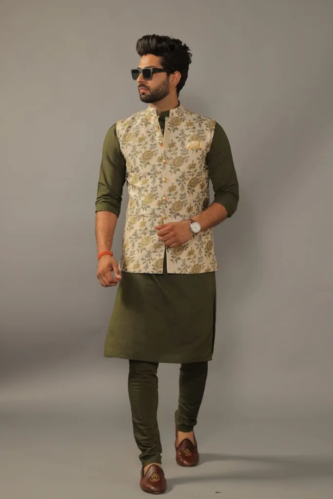 A man wearing a printed nehru jacket with solid colored kurta 