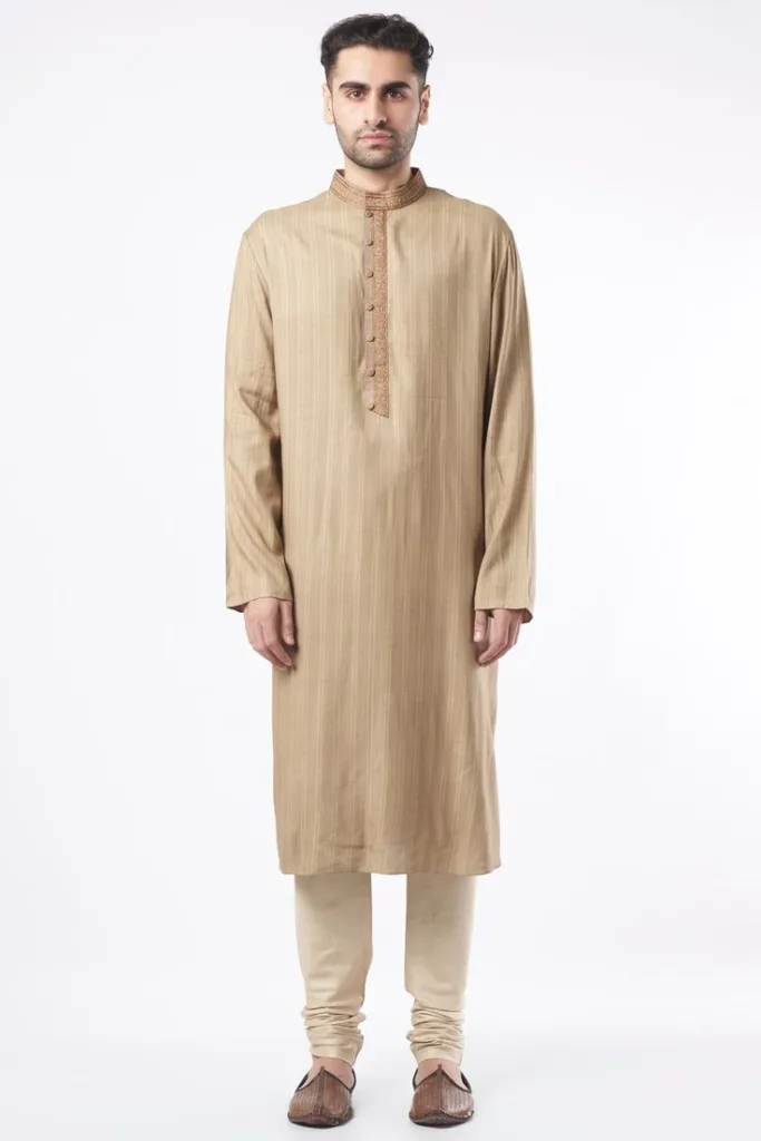 5 Elegant Traditional Bengali Outfits Every Man Must Try 5 5 Elegant Traditional Bengali Outfits Every Man Must Try A man has paired Designed Kurta with Churidar, one of the traditional Bengali outfits