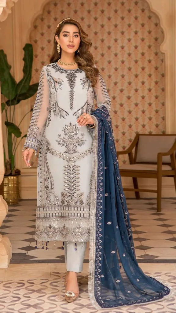 Designer embroidered salwar kameez featuring premium chiffon dupattas with intricate silver detailing.