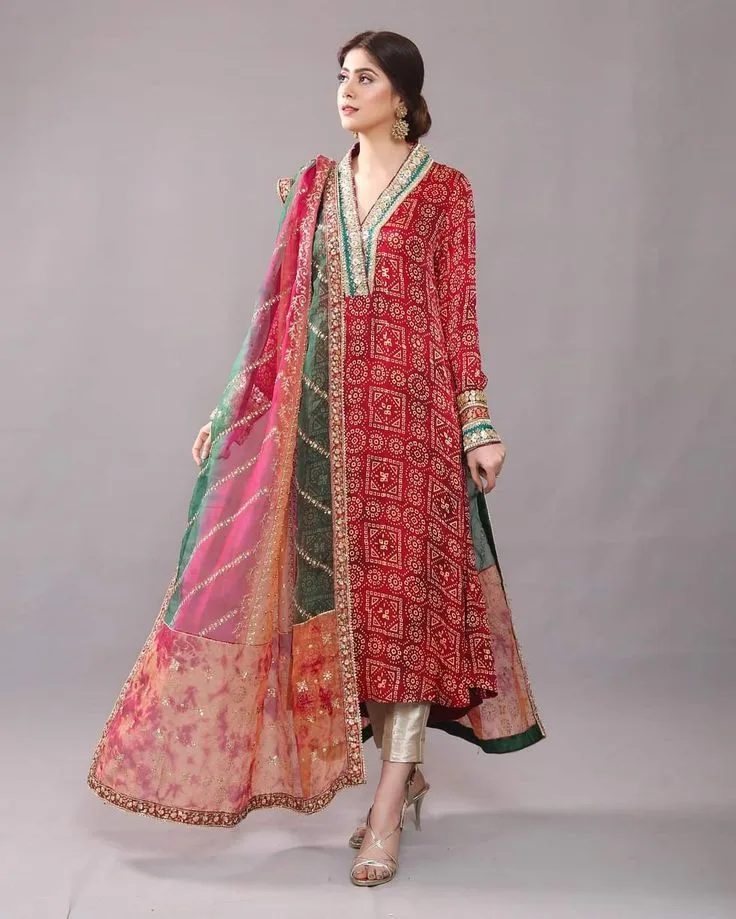 Chiffon dupattas are elegant -woman wearing a vibrant chiffon dupatta in an open drape over the shoulder