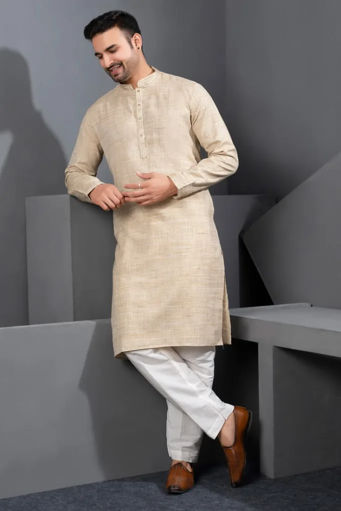 A man wearing a cotton kurta pajama, which is the right fabric for festive and traditional occasions like weddings