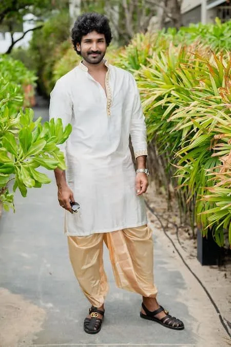 A man wearing a classic cotton kurta with dhoti pants